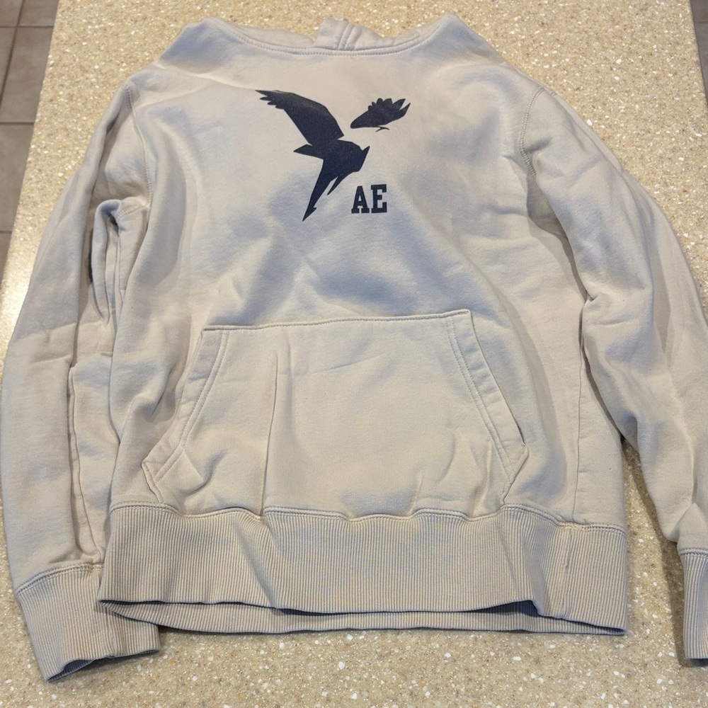 American Eagle Outfitters Men's Beige Sweater with Dark Blue Graphic